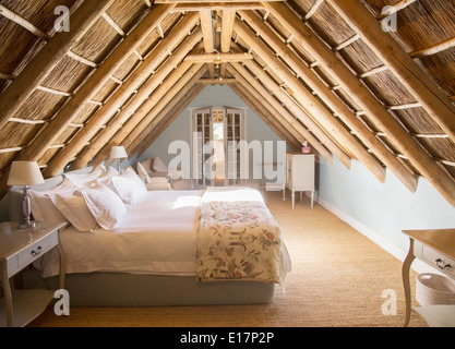 Sunny luxury attic bedroom Stock Photo