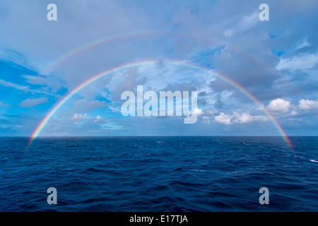 Double rainbow at sea over the Atlantic Ocean, the morning of the total eclipse of the Sun, Nov 3, 2013, from the Star Flyer Stock Photo
