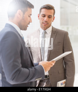 Businessmen using digital tablet Stock Photo