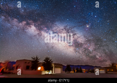 The summer Milky Way and centre of the Galaxy area in Scorpius and Sagittarius rising above the adobe lodges at the Painted Pony Stock Photo