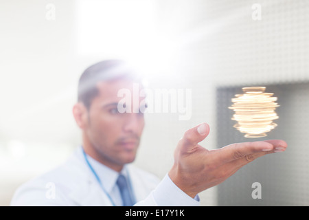 Scientist holding molecule model Stock Photo