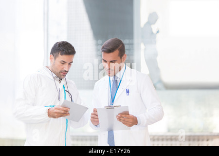 Scientists with digital tablet and clipboard Stock Photo