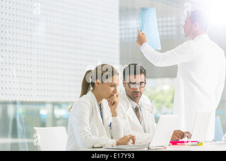 Doctors working in hospital Stock Photo
