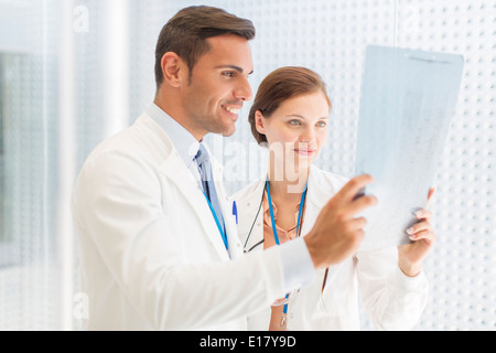 Doctors examining x-ray in hospital Stock Photo