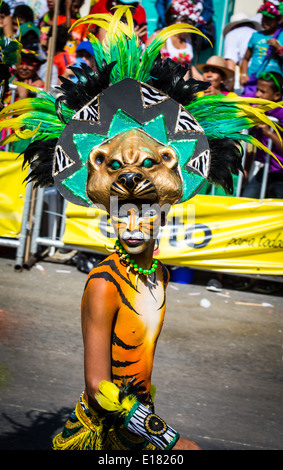 Barranquilla, Colombia - March 1, 2014 - Performers in elaborate costume sing, dance, and stroll their way down the streets of Barranquilla during the Battalla de Flores. The Pinnacle of the Carnival de Barranquilla parades. Stock Photo