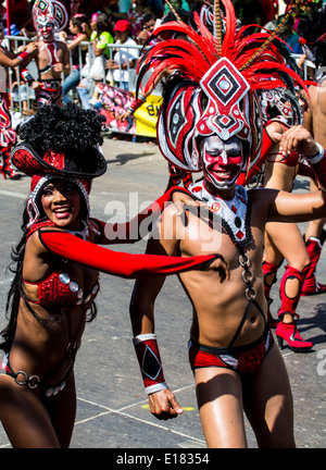 Barranquilla, Colombia - March 1, 2014 - Performers in elaborate costume sing, dance, and stroll their way down the streets of Barranquilla during the Battalla de Flores during Carnival Stock Photo