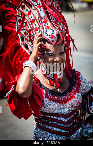 Barranquilla, Colombia - March 1, 2014 - Performers in elaborate costume sing, dance, and stroll their way down the streets of Barranquilla during the Battalla de Flores during Carnival Stock Photo