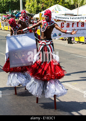 Barranquilla, Colombia - March 1, 2014 - Performers in elaborate costume sing, dance, and stroll their way down the streets of Barranquilla during the Battalla de Flores during Carnival Stock Photo