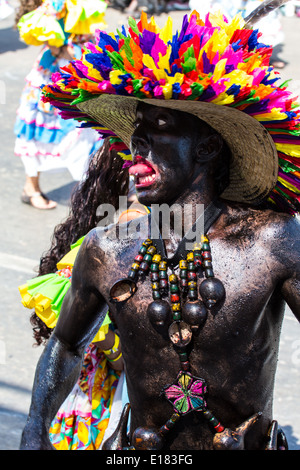 Barranquilla, Colombia - March 1, 2014 - Performers in elaborate costume sing, dance, and stroll their way down the streets of Barranquilla during the Battalla de Flores during Carnival Stock Photo