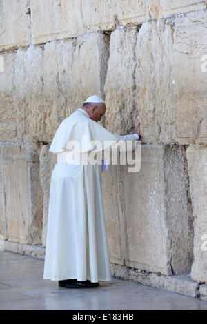 Jerusalem. 26th May, 2014. Pope Francis prays in front of the Western Wall, Judaism's holiest site, in the Old City of Jerusalem on May 26, 2014. In his first Middle East tour since his anointment in 2013, Pope Francis held a historic prayer service with the Ecumenical Patriarch in Jerusalem on Sunday. This was the first reunion between the two Christian sects in fifty years. (Handout Credit:  Handout Kobi Gideon-Isr/APA Images/ZUMAPRESS.com/Alamy Live News