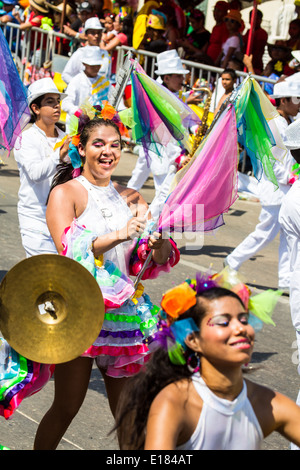 Barranquilla, Colombia - March 1, 2014 - Performers in elaborate costume sing, dance, and stroll their way down the streets of Barranquilla during the Battalla de Flores during Carnival Stock Photo