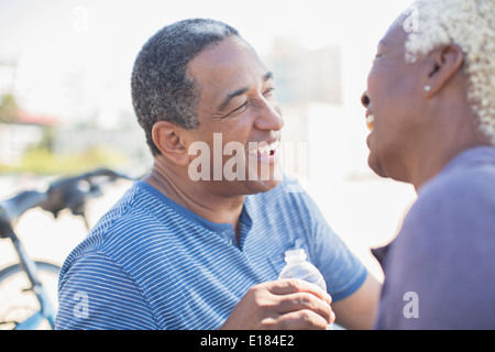 Senior couple laughing outdoors Stock Photo