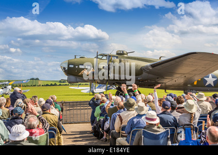 Sally B, a Boeing B17 Flying Fortress, taxi past fans and spectators at a Duxford airshow, Duxford ,Cambridge, England UK Stock Photo