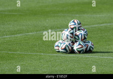 Passeier, Italy. 25th May, 2014. Official FIFA World Cup balls 'Brazuca' are piled up to form a pyramide on the pitch prior to a friendly match between der German national soccer team and the German U20 team on a training ground at St. Leonhard in Passeier, Italy, 25 May 2014. Germany's national soccer squad prepares for the upcoming FIFA World Cup 2014 in Brazil at a training camp in South Tyrol until 30 May 2014. Photo: Andreas Gebert/dpa/Alamy Live News Stock Photo