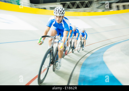 Track cyclist racing in velodrome Stock Photo