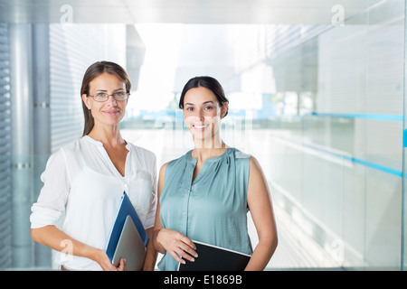 Portrait of confident businesswomen in office Stock Photo