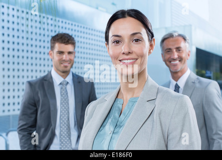 Portrait of confident business people outdoors Stock Photo