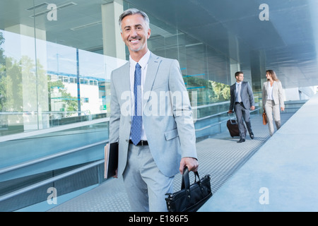 Portrait of businessman leaving office Stock Photo