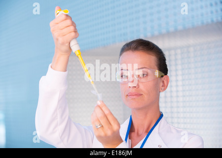 Scientist using pipette Stock Photo