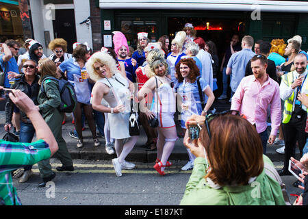 Gay men. Drag Queens. Soho, London, UK , 25th May 2014. A group of gay homosexual men wearing costumes partying / celebrating in Soho, London, UK. Credit:  Alamy Live News Stock Photo
