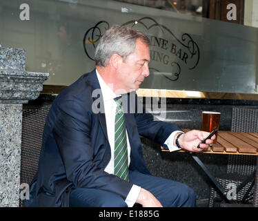 London, UK, 26th May, 2014. Nigel Farage enjoys his first Victory pint outside Nicholson pub  Broadway Street London He went with UKIP Team to celebrate MEP election victory May 2014 Credit:  Prixpics/Alamy Live News Stock Photo