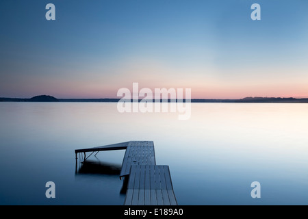 Dock over still lake, Saratoga Lake, New York, United States Stock Photo