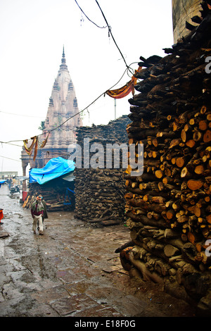 Mother Ganga,Ganga River,wood piles for cremations,gifts,blessings,River Boats, Pilgrims,Varanasi,Benares,Uttar Pradesh,India Stock Photo