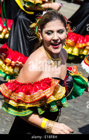 Barranquilla, Colombia - March 1, 2014 - Performers in elaborate costume sing, dance, and stroll their way down the streets of Barranquilla during the Battalla de Flores during Carnival Stock Photo