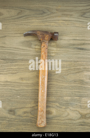 Vertical photo of an old claw hammer on aged wood Stock Photo