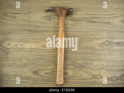 Horizontal photo of an old claw hammer on aged wood Stock Photo