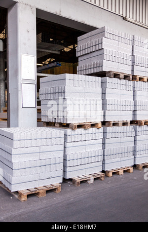Cement building blocks stacked on pallets Stock Photo
