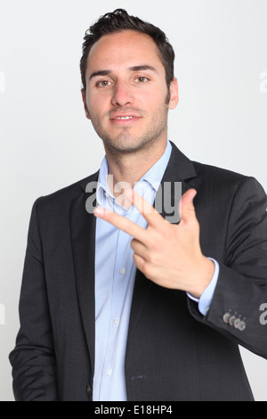 Businessman counting number three Stock Photo