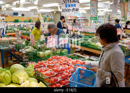People at Japanese grocery store. Tokyo, Japan. Stock Photo