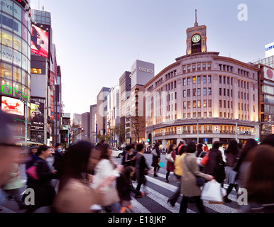 People crossing street in front of Wako Department Store building in Ginza, Tokyo, Japan 2014. Stock Photo