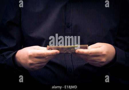 A man holds in the hands of Polish money Stock Photo