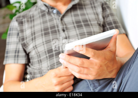young man using a tablet computer Stock Photo