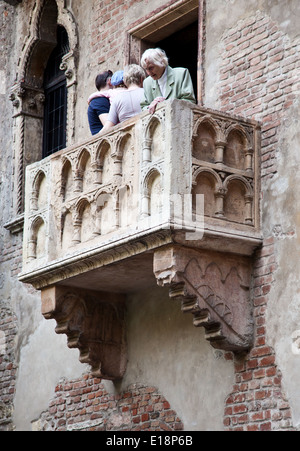 Tourists on famous balcony of William Shakespeares Romeo and Juliet in Verona, Italy Stock Photo