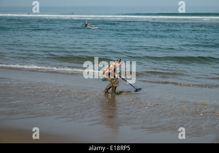 treasure hunter on beach Stock Photo