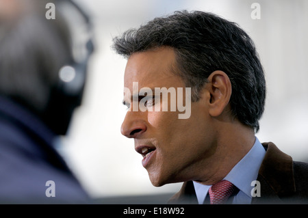 Matthew Amroliwala (BBC television newsreader) doing an outside election broadcast from College Green, Westminster. 2014 Stock Photo