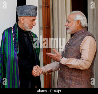 New Delhi, India. 27th May, 2014. Indian Prime Minister Narendra Modi (R) shakes hands with Afghan President Hamid Karzai before their meeting at Hyderabad House in New Delhi, India, May 27, 2014. Credit:  Partha Sarkar/Xinhua/Alamy Live News Stock Photo