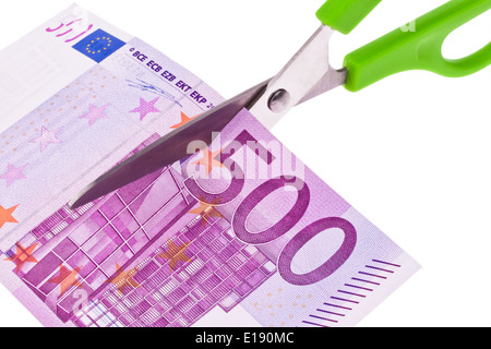 Von einem Euro Geldschein wird mit einer Schere ein St¸ck abgeschnitten. Symbol Steuern und Abgaben. Stock Photo