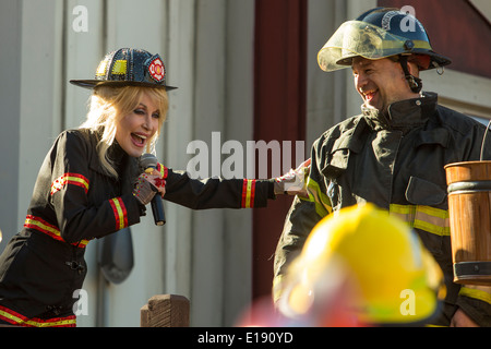 Dolly Parton inaugurates the new FireChaser Express roller coaster dressed as a fireman in Dollywood theme park in Pigeon Forge Stock Photo