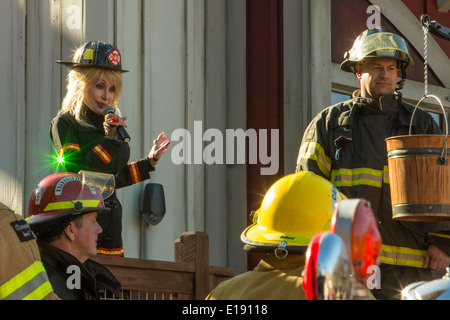 Dolly Parton inaugurates the new FireChaser Express roller coaster dressed as a fireman in Dollywood theme park in Pigeon Forge Stock Photo