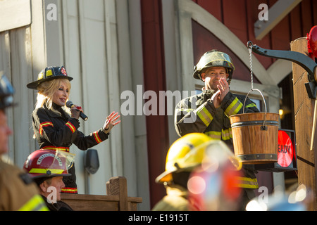 Dolly Parton inaugurates the new FireChaser Express roller coaster dressed as a fireman in Dollywood theme park in Pigeon Forge Stock Photo