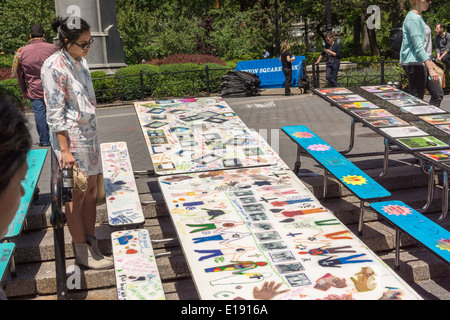 School lunchroom tables decorated with art representing various social issues are seen in Union Square Park in New York Stock Photo