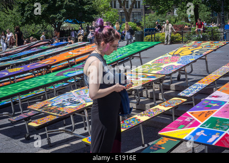 School lunchroom tables decorated with art representing various social issues are seen in Union Square Park in New York Stock Photo