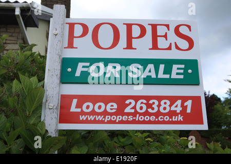 Estate Agents sign / board (For Sale ) outside a property in Cornwall. Stock Photo