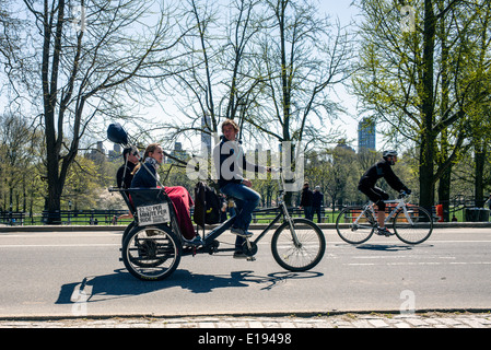 Tourists ride pedicabs on a tour through New York City's Central Park in the spring.
