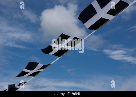 Cornish Flag (Kernow) bunting flying in cornwall on a windy day, Stock Photo