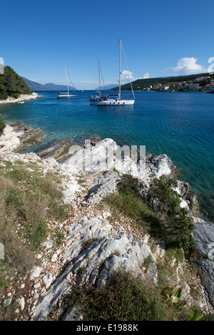 Village of Fiskardo, Kefalonia. Picturesque view of yachts moored in Fiskardo harbour. Stock Photo